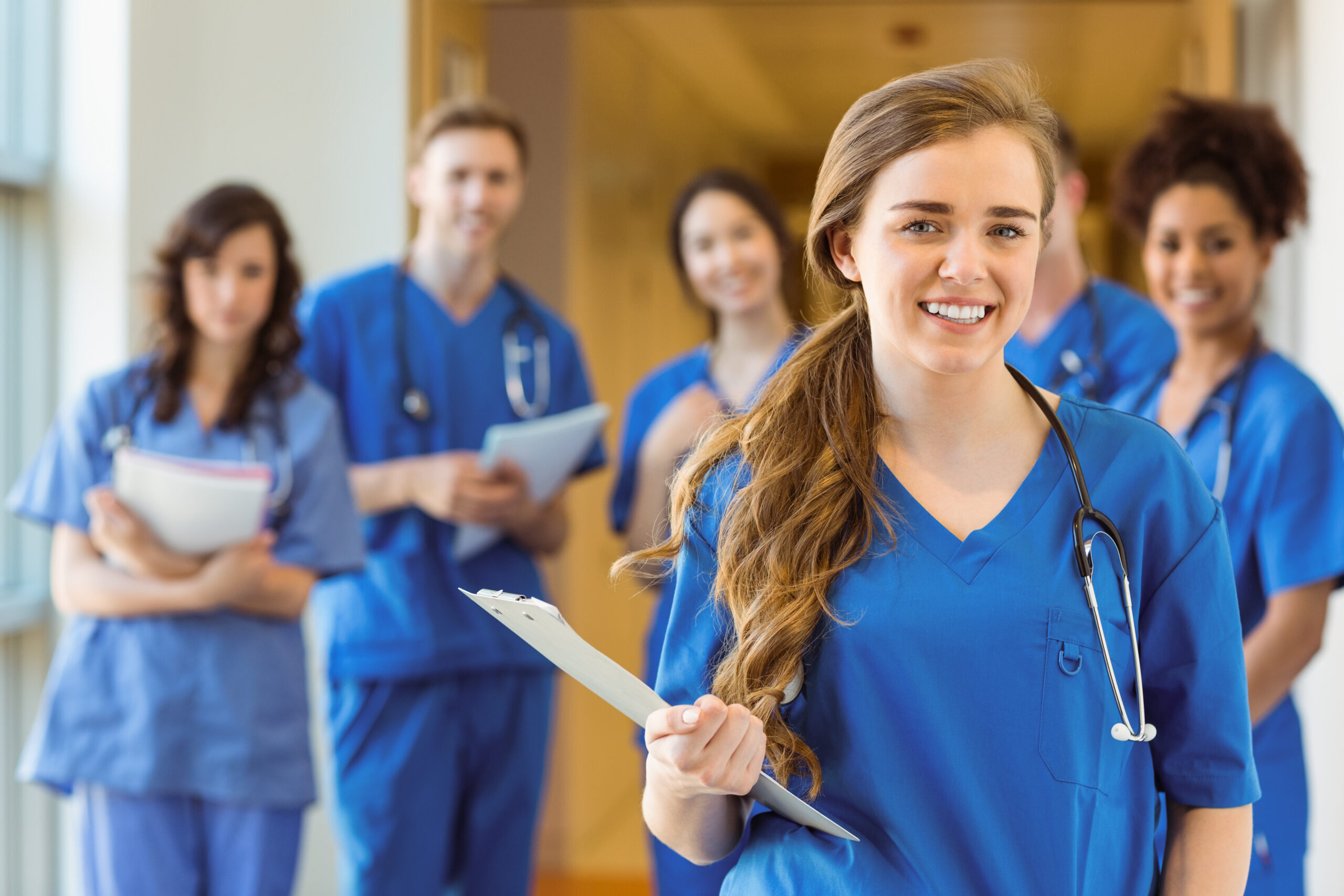 Medical students smiling at the camera at the university